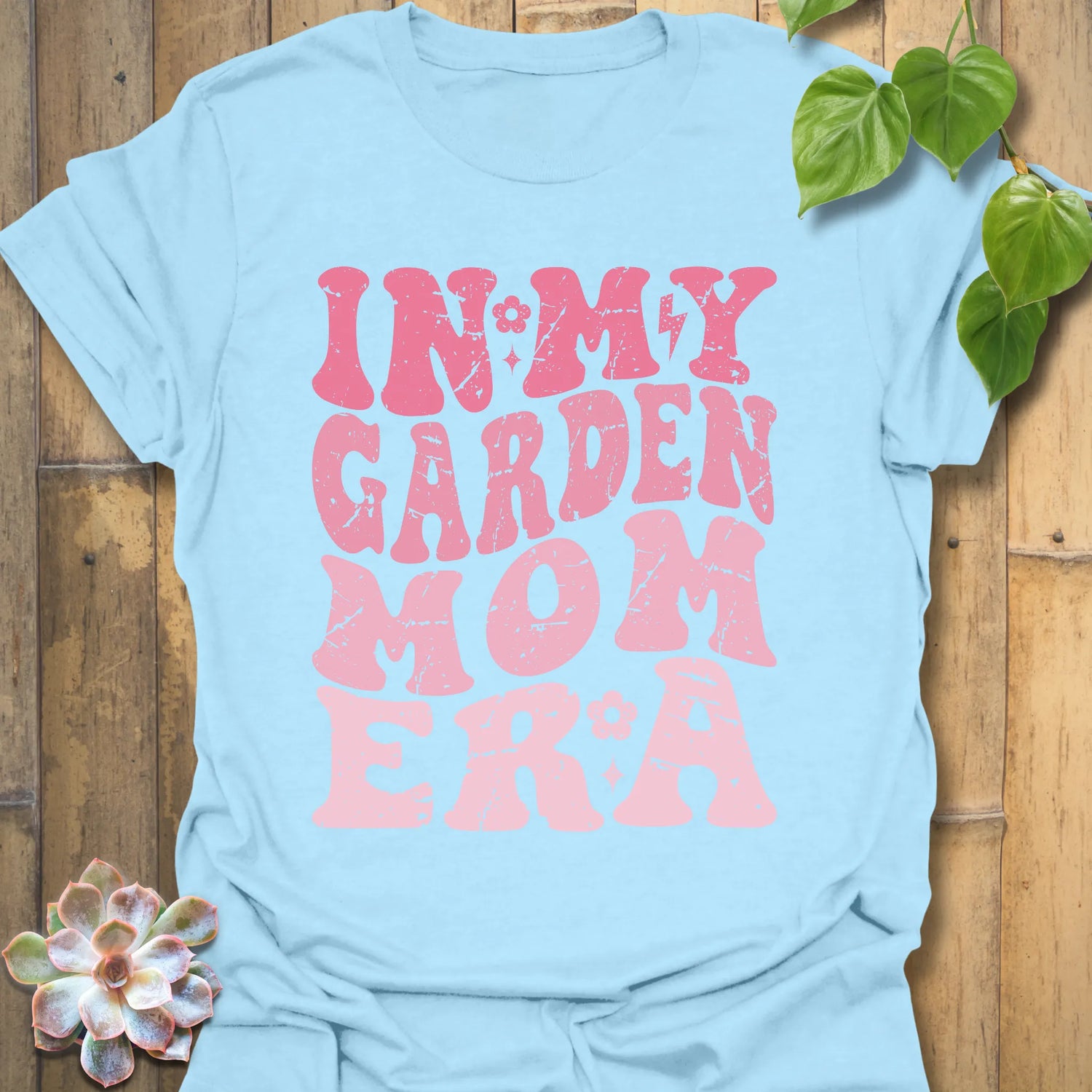 Light Blue t-shirt featuring the design In My Garden Mom Era printed in bold letters, gardening shirt for moms.