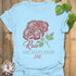 Light Blue t-shirt featuring the design June Rose with a soft rose flower print, a floral graphic tee ideal for summer outfits.