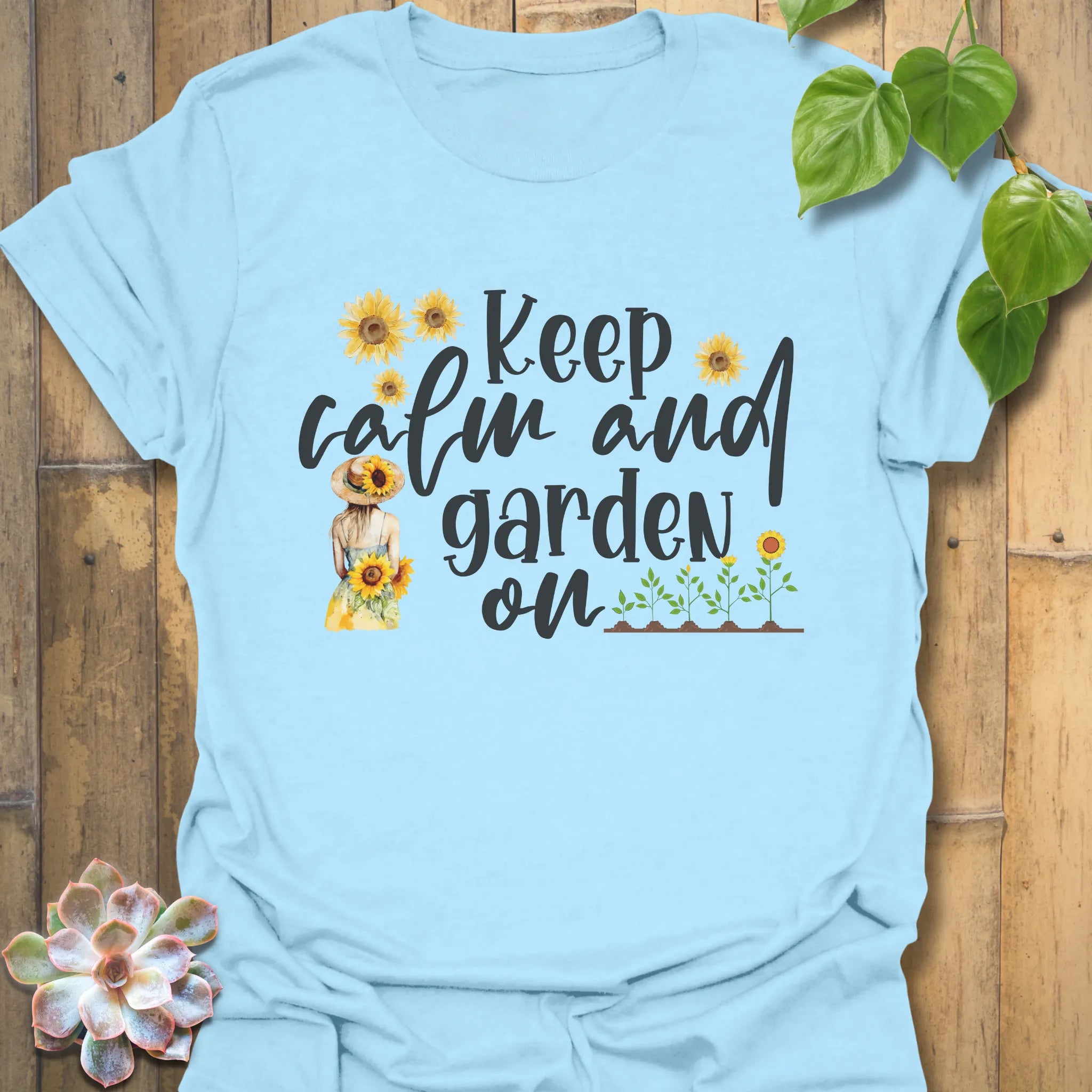 Light Blue t-shirt featuring the design Keep Calm and Garden On, stylish garden t-shirt.