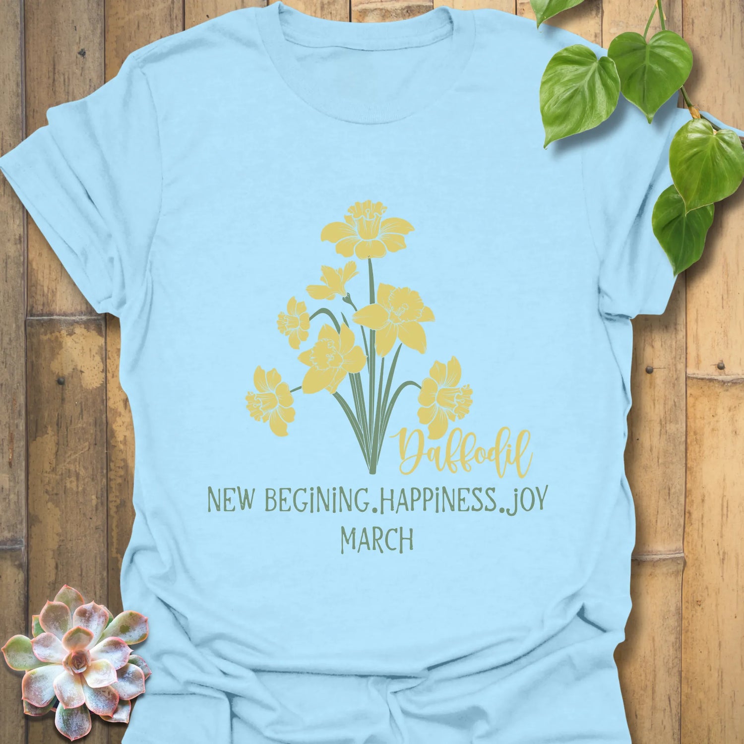 Light Blue t-shirt featuring the design March Daffodil with a print of flower Rose, a soft pastel floral shirt.