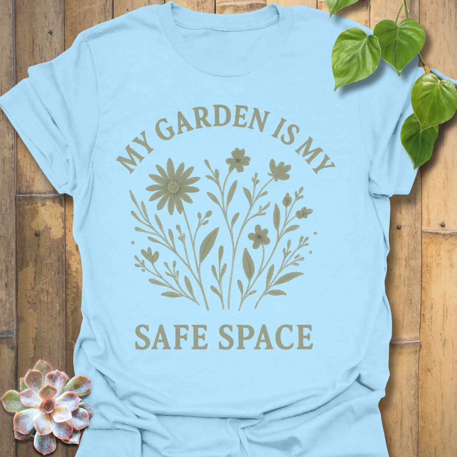 Light Blue t-shirt featuring the design My Safe Place printed in bold letters, warm tone mindfulness shirt.