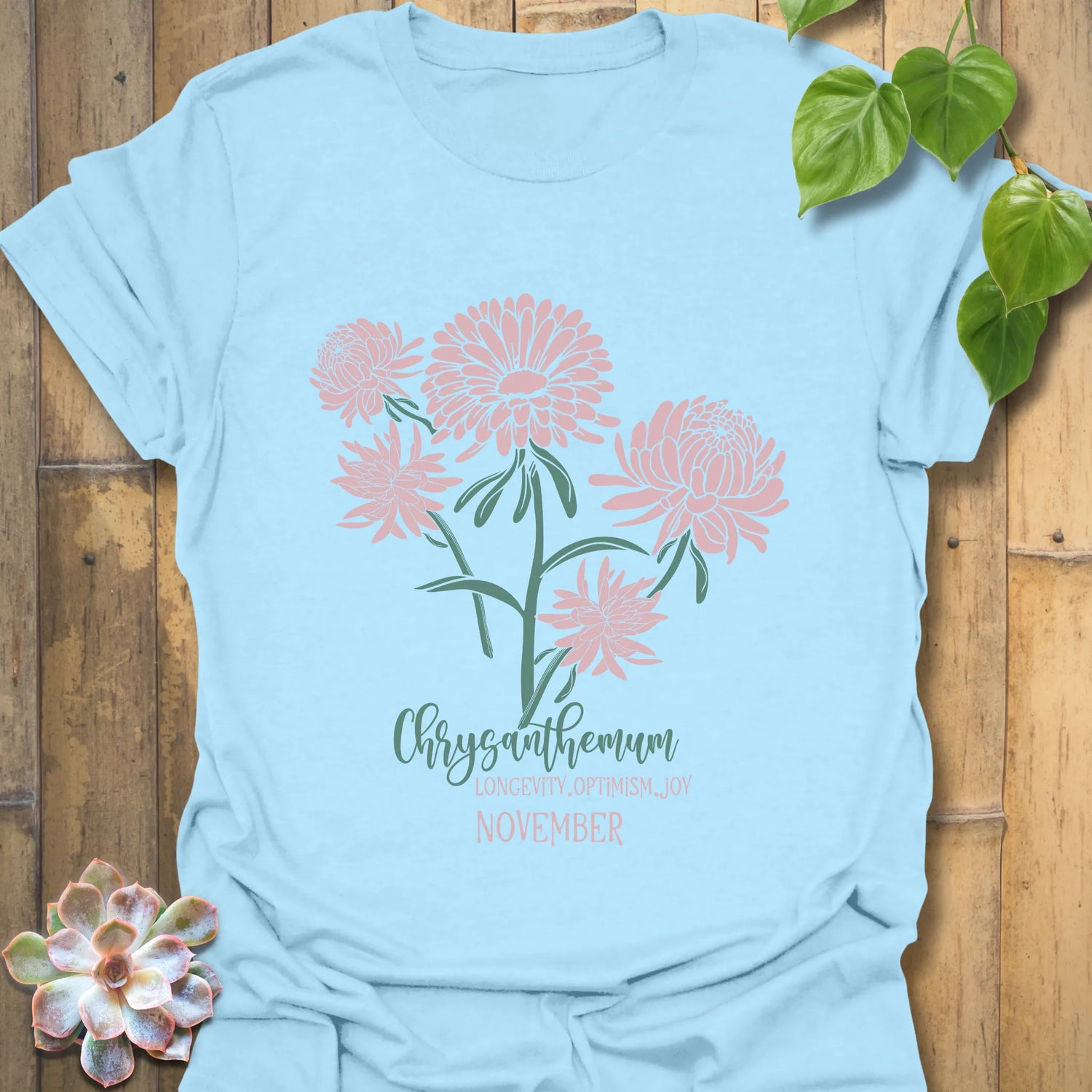 Light Blue t-shirt featuring the design November Chrysanthemum with a chrysanthemum flower print, trendy floral graphic tee for casual outfits.