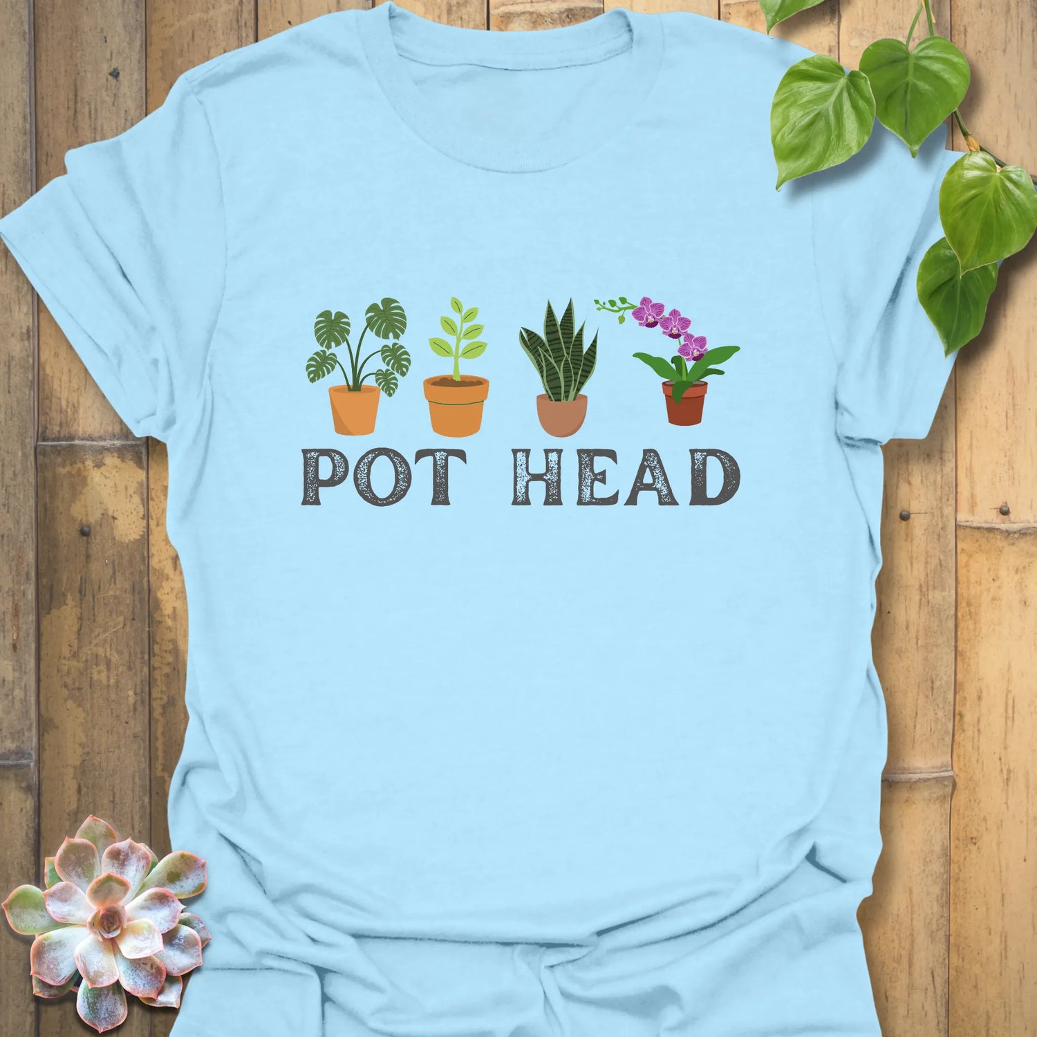 Light Blue t-shirt featuring the design Pot Head with flowers in a pot, cute plant graphic shirt.