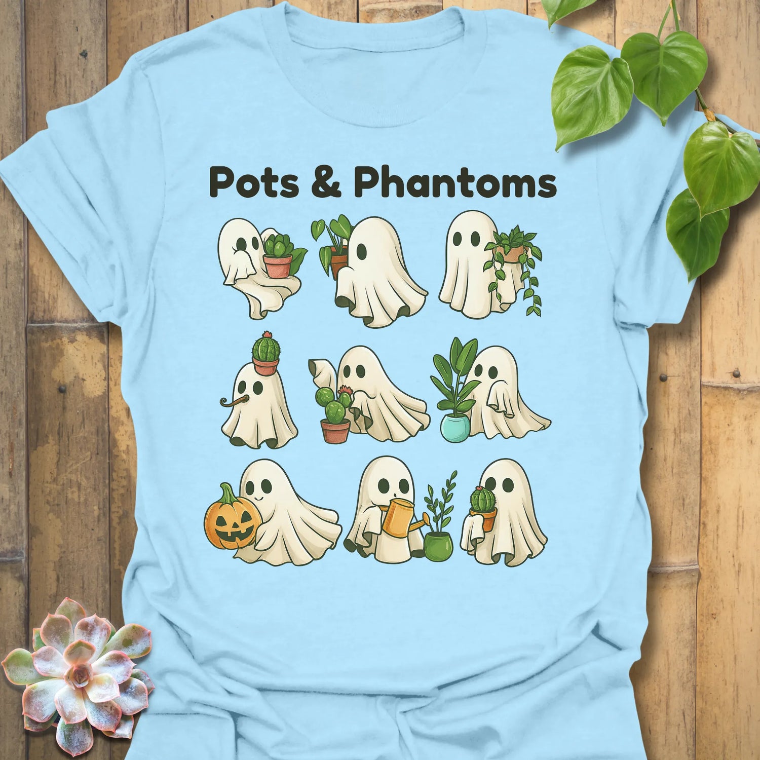 Light Blue t-shirt featuring the design Pots &amp; Phantom printed in bold black letters, halloween graphic shirt