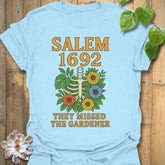 Light Blue t-shirt featuring the design Salem 1692 printed in bold letters, vintage halloween graphic tee.