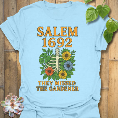 Light Blue t-shirt featuring the design Salem 1692 printed in bold letters, vintage halloween graphic tee.