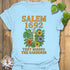 Light Blue t-shirt featuring the design Salem 1692 printed in bold letters, vintage halloween graphic tee.