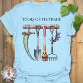 Light Blue t-shirt featuring the design Tools Of The Trade printed in bold letters, garden tools shirt.