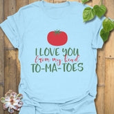 Light blue t-shirt featuring the design I Love You From My Head TO-MA-TOES with playful tomato print, casual humour tee.