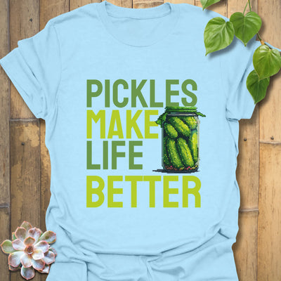 Light blue t-shirt featuring the design “Pickles make life better” with cucumbers inside a glass jar