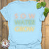 Light blue t-shirt featuring the design Sow Water Grow printed with a botanical watering can illustration.