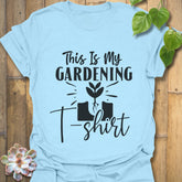 Light blue t-shirt featuring the design This Is My Gardening T-shirt printed in bold lettering, a fun plant lover shirt for gardeners.