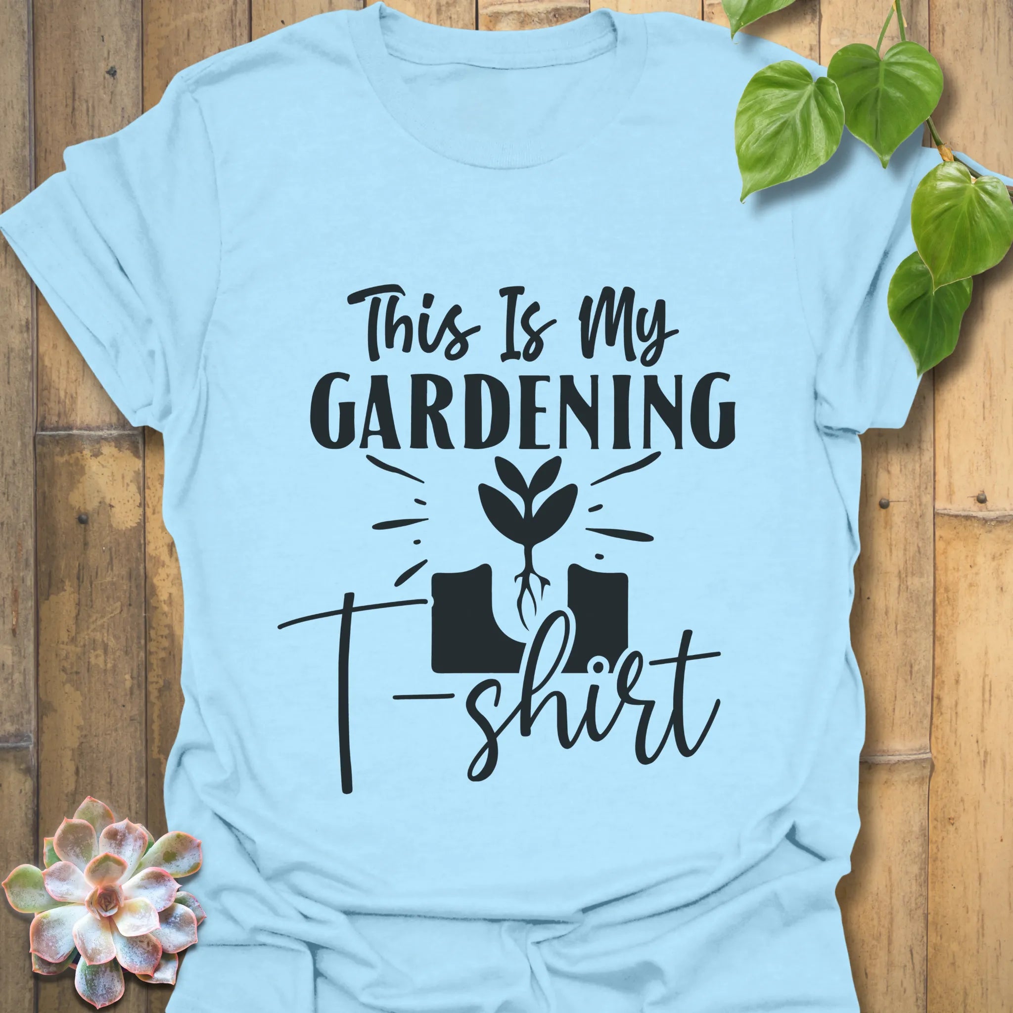 Light blue t-shirt featuring the design This Is My Gardening T-shirt printed in bold lettering, a fun plant lover shirt for gardeners.