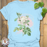 Light blue t-shirt with the Blossom Whisper design featuring a soft flower illustration