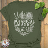 Military Green t-shirt featuring the design Botanical Magic printed in bold letters, floral graphic tee.