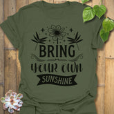 Military Green t-shirt featuring the design Bring Your Own Sunshine printed in bold black letters, positive vibes shirt.