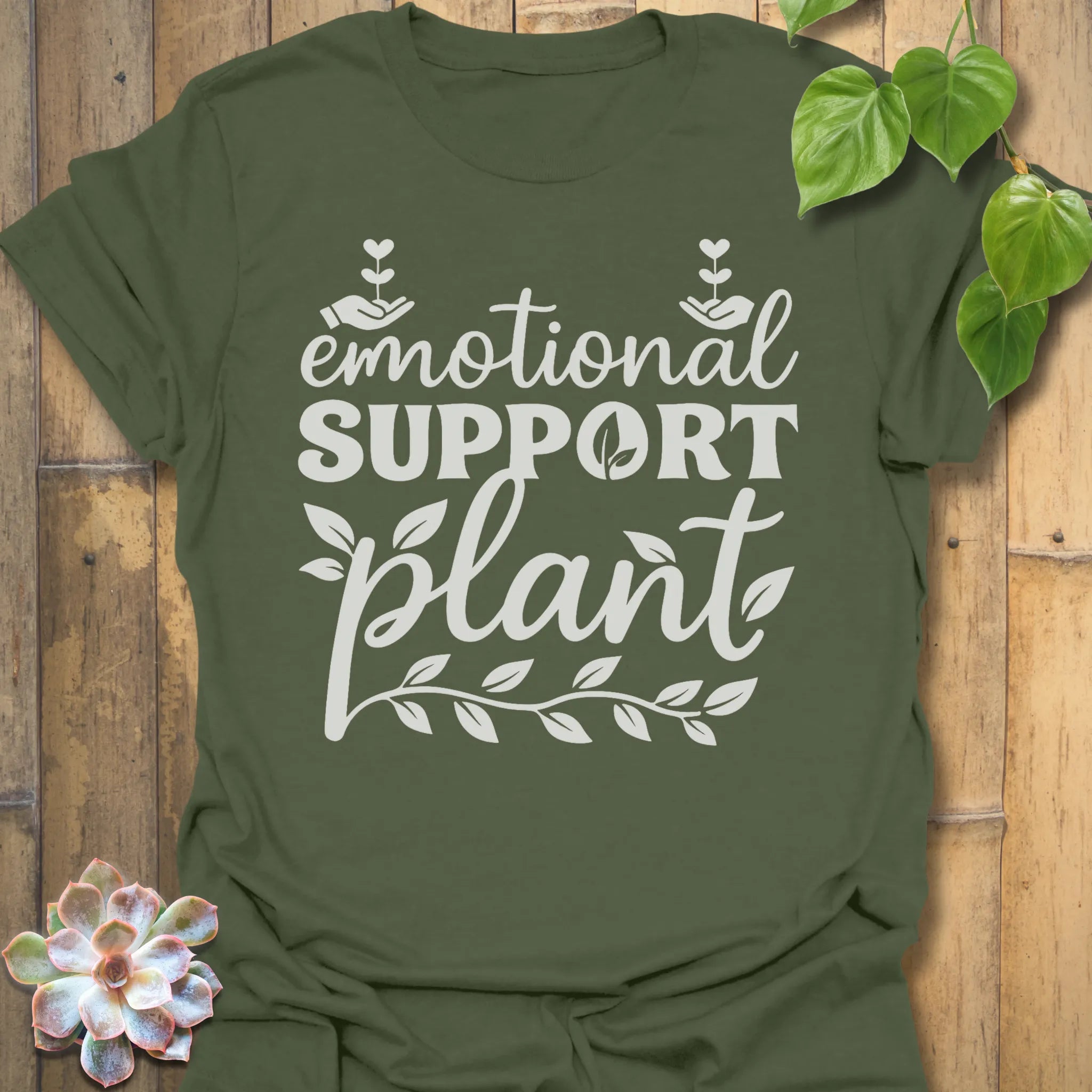Military Green t-shirt featuring the design Emotional Support printed in bold letters, plant wellness graphic shirt.