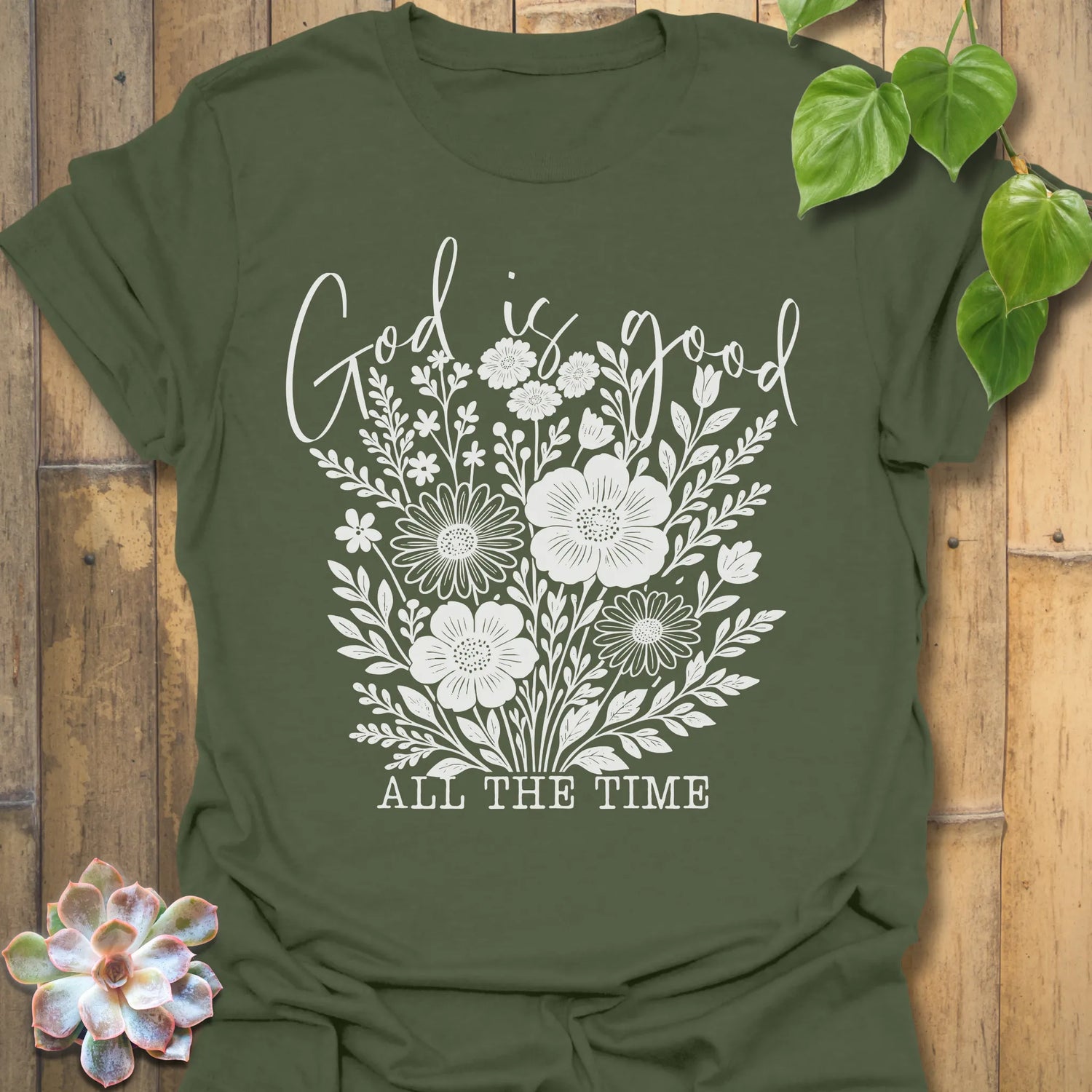 Military Green t-shirt featuring the design God Is Good printed in black letters, religious faith shirt.