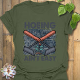Military Green t-shirt featuring the design Hoeing Ain’t Easy, outdoor gardening humour shirt.