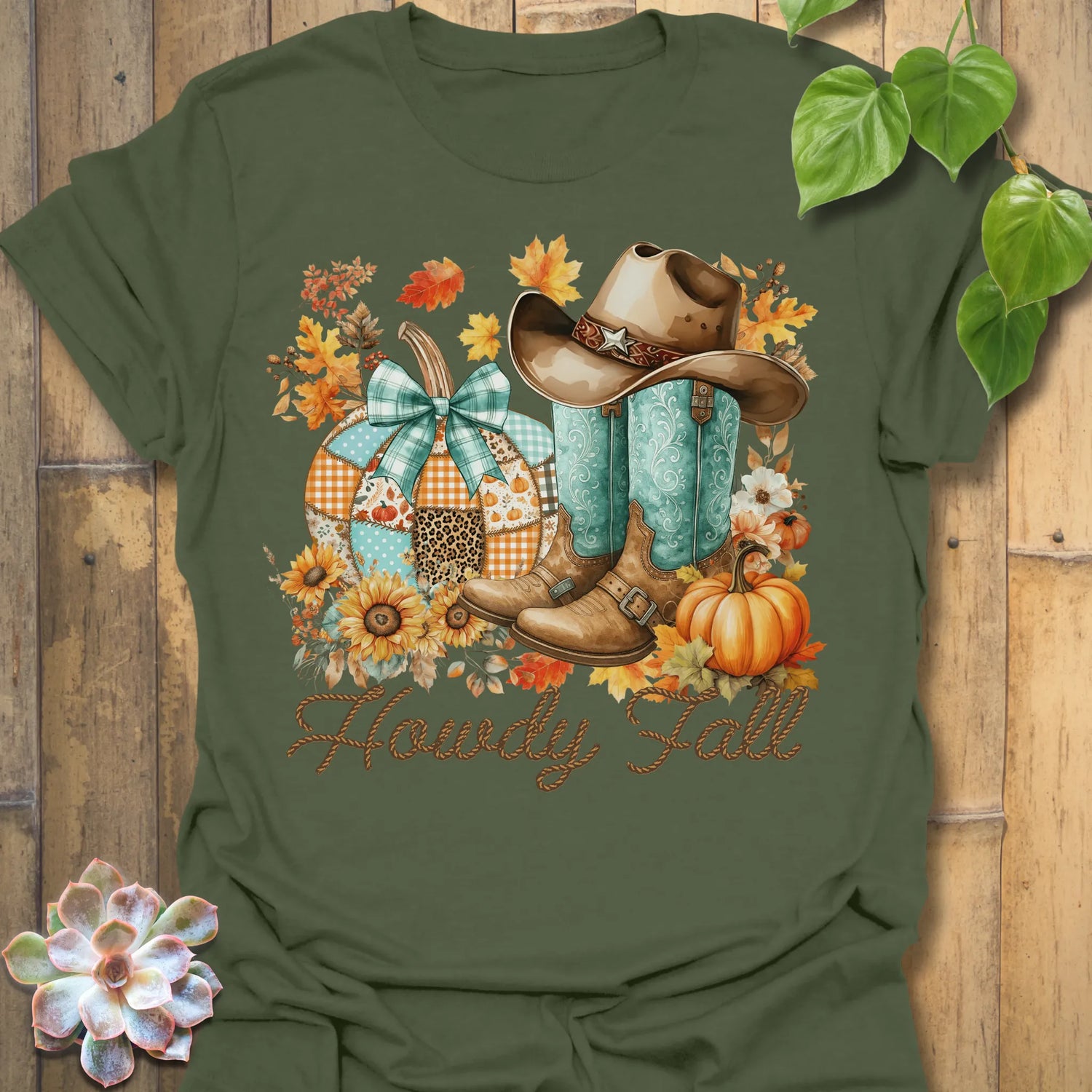 Military Green t-shirt featuring the design Howdy Fall printed in brown letters, cute fall aesthetic shirt.