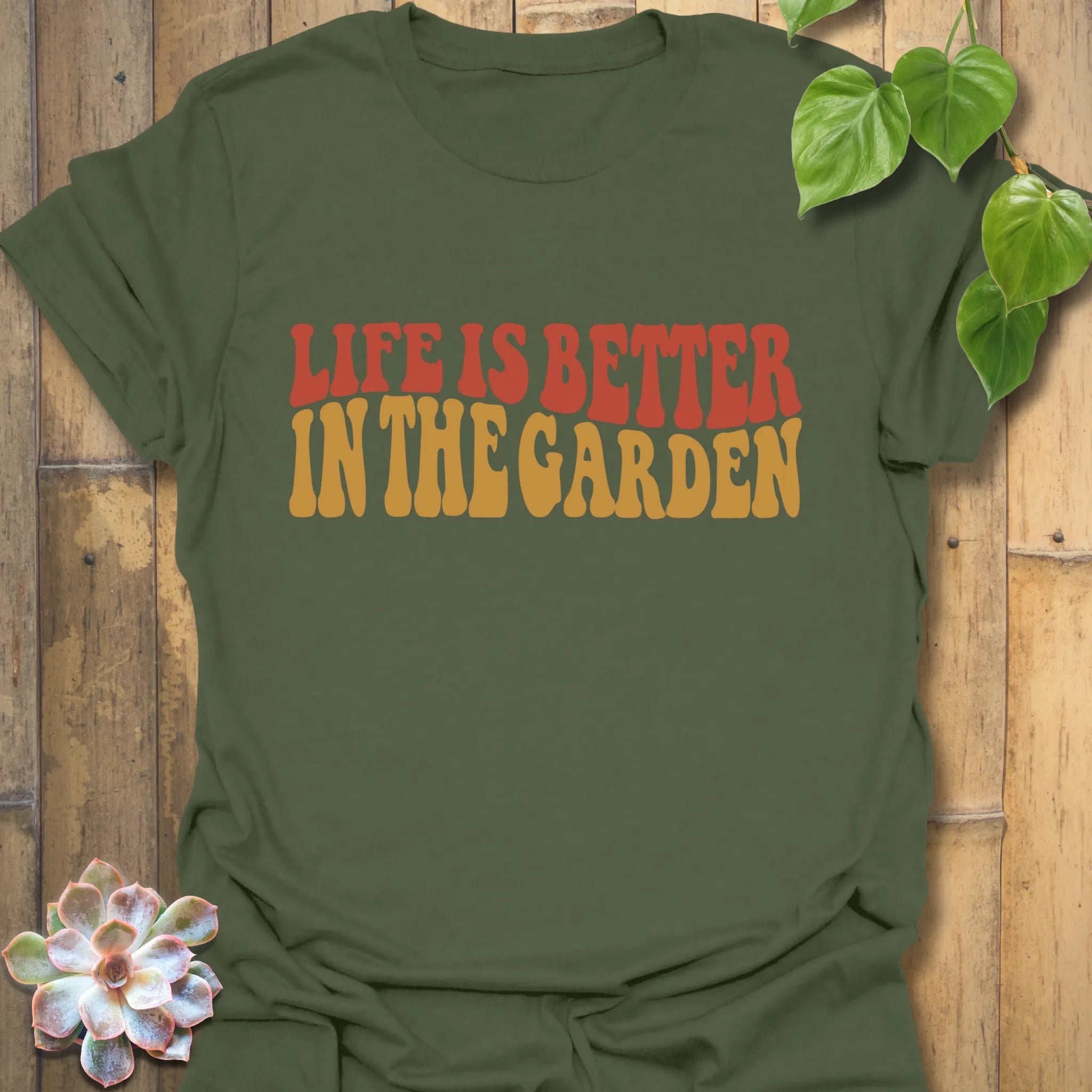 Military Green t-shirt featuring the design Life is better in the garden printed in green floral lettering, rustic outdoor garden shirt