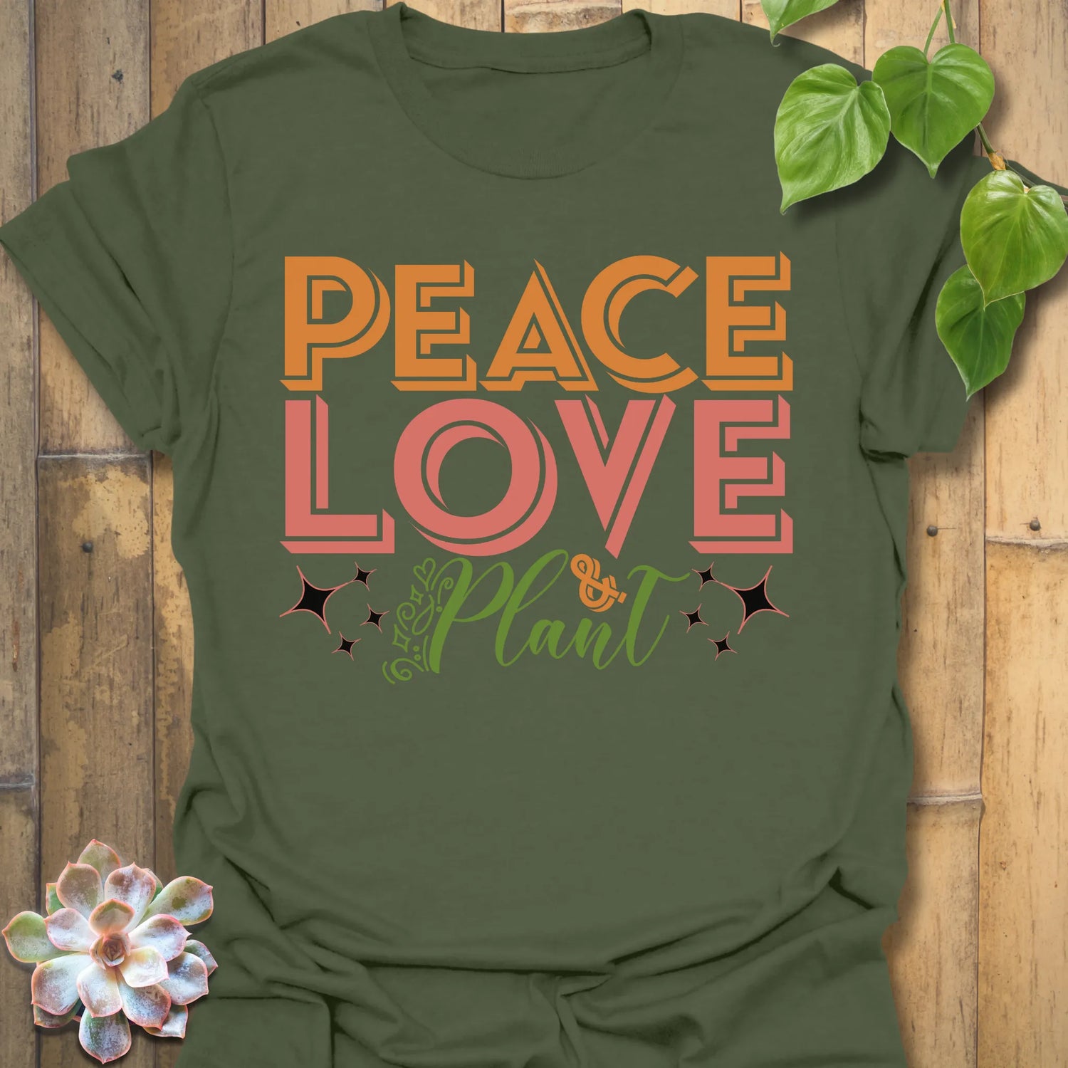 Military Green t-shirt featuring the design Peace Love Plant printed in bold letters, gardening lover shirt.