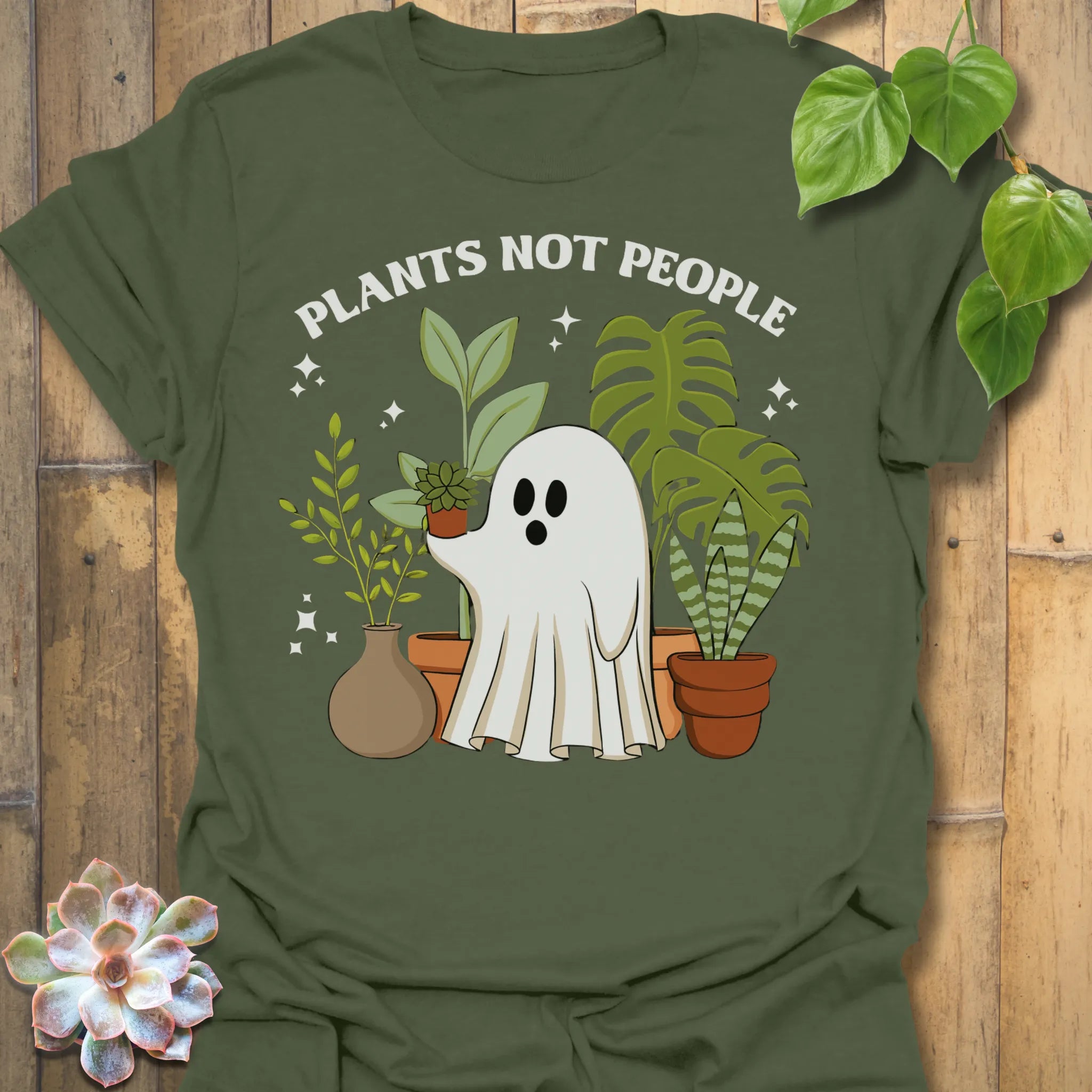 Military Green t-shirt featuring the design Plants Not People printed in bold white letters, halloween plant lover graphic tee.
