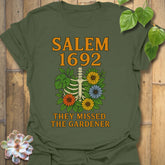 Military Green t-shirt featuring the design Salem 1692 printed in bold letters, vintage halloween graphic tee.