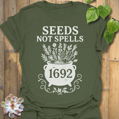 Military Green t-shirt featuring the design Seeds Not Spells printed in bold letters, halloween plant lover shirt.