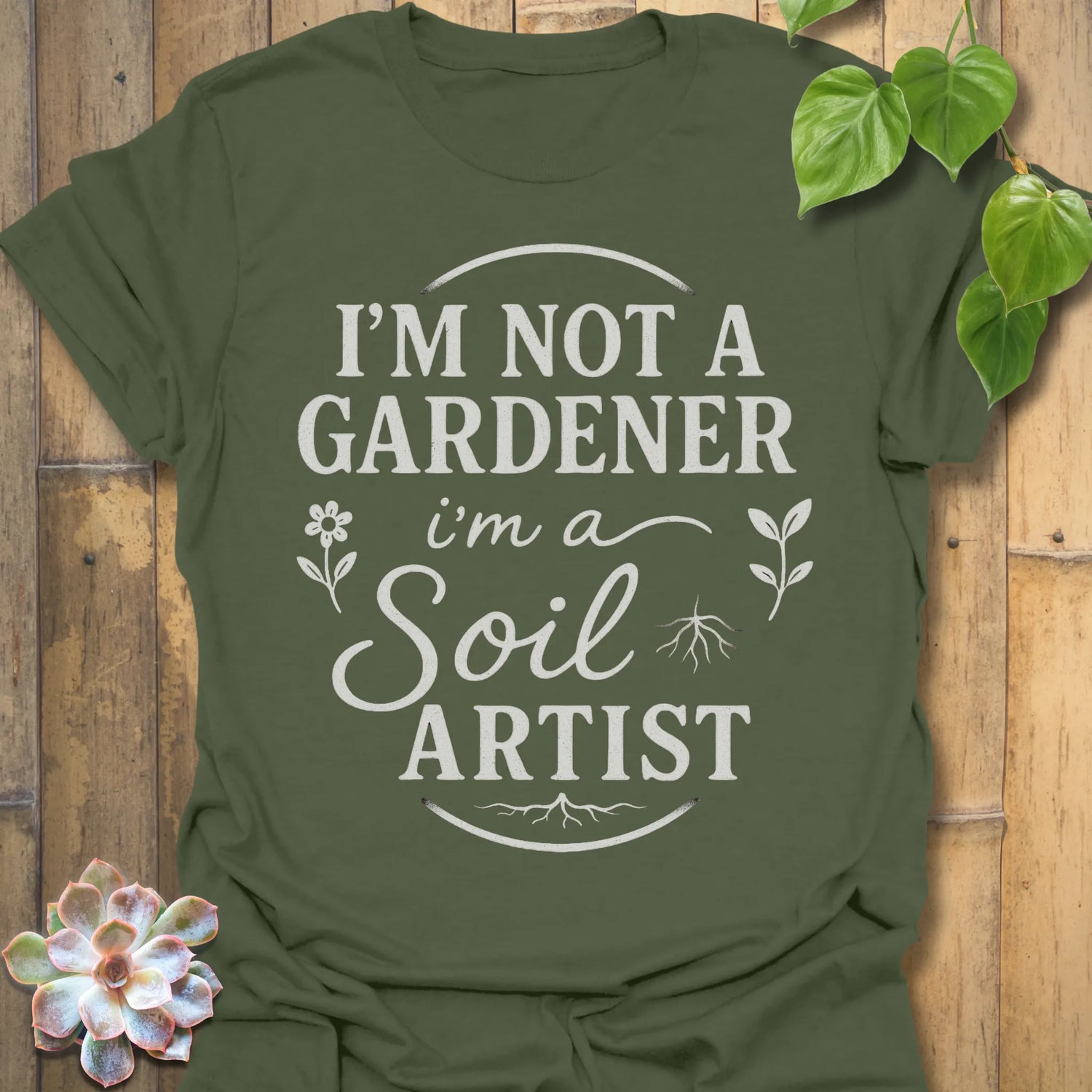 Military Green t-shirt featuring the design Soil Artist printed in bold letters, funny garden shirt.
