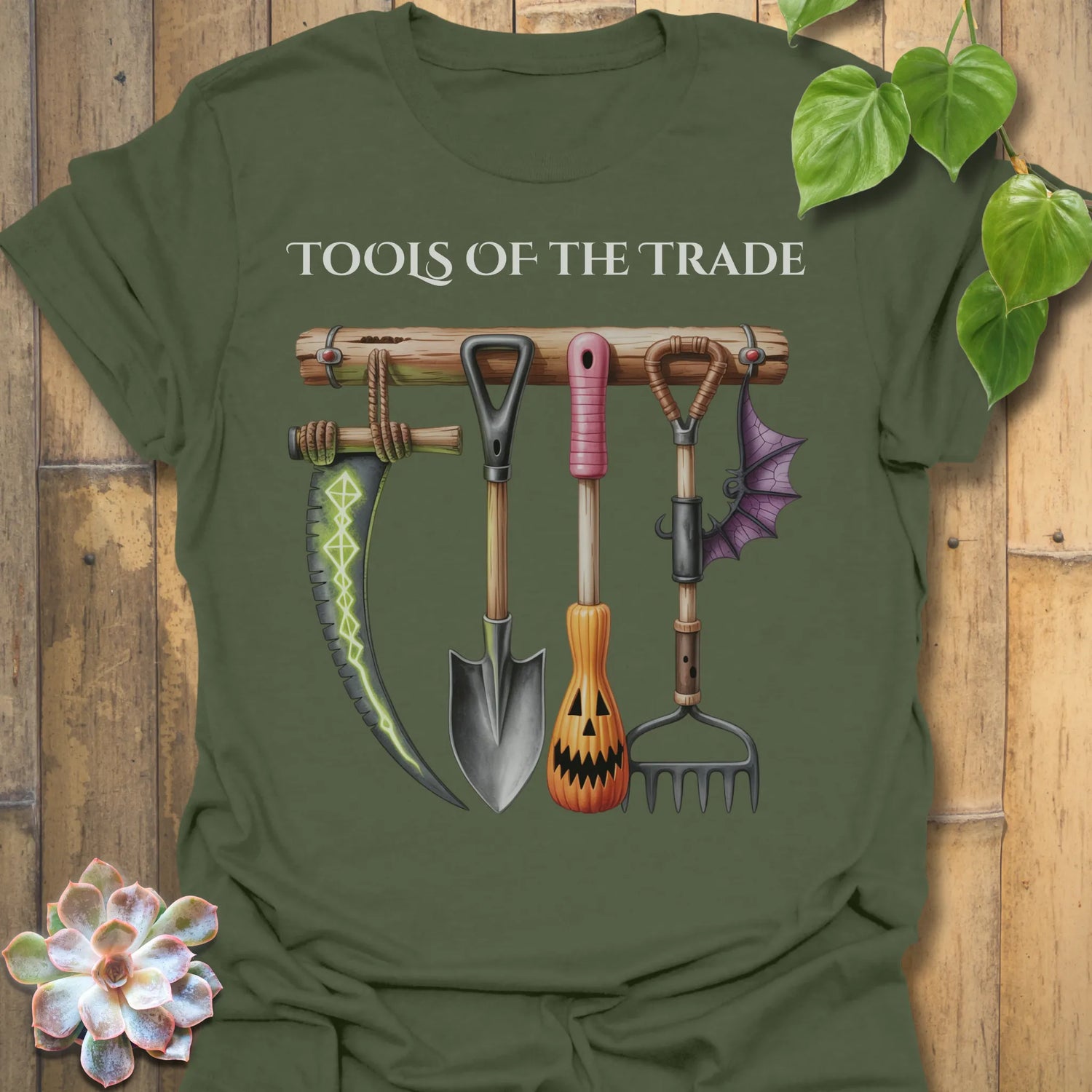 Military Green t-shirt featuring the design Tools Of The Trade printed in bold letters, garden tools shirt.