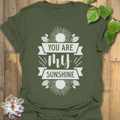 Military Green t-shirt featuring the design You Are My Sunshine printed in bold letters, nature-inspired graphic tee.