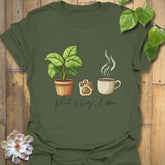 Military Green t-shirt with “Plant, Dog, Coffee” print – trendy unisex tee for dog moms, plant parents, coffee fans.
