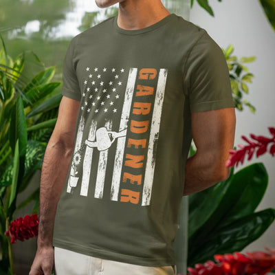 Military green American flag garden t-shirt featuring the design Gardener with a vertical word, plant, and watering sprinkler print, ideal for proud gardeners