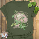 Military green t-shirt displaying the Blossom Whisper design with a soft floral illustration