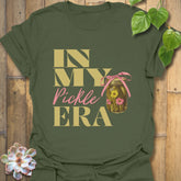 Military green t-shirt displaying the playful “In My Pickle ERA” design with cucumbers inside a jar