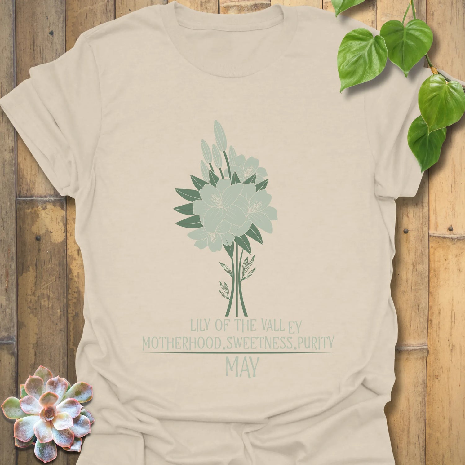 Natural colour t-shirt featuring the design May Lily of the Valley with Rose flower print, ideal for nature-inspired minimalist fashion.