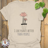 Natural colour t-shirt with the phrase “I like plants better than people” and a flower in a pot design