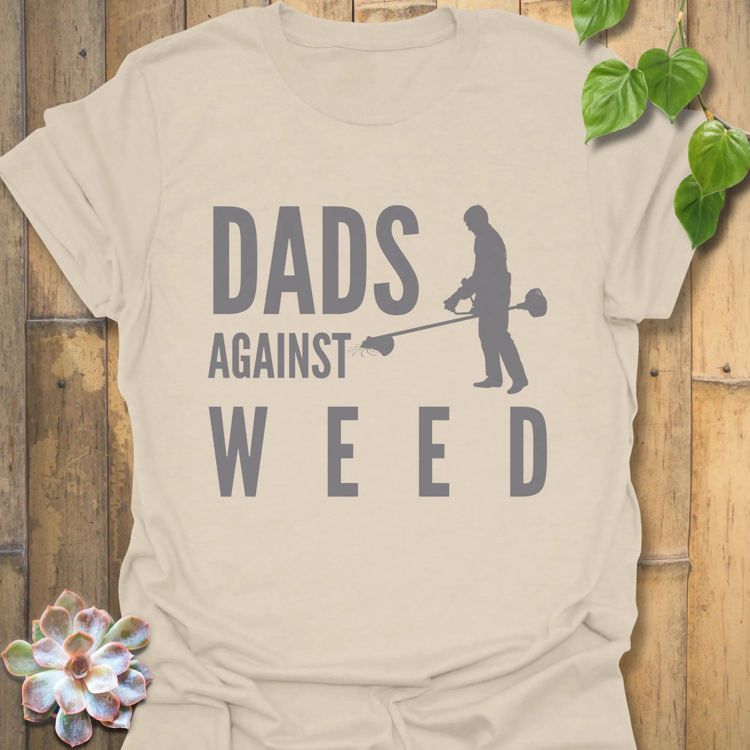 Natural t-shirt featuring the design Dad Against Weeds, weed control dad shirt.