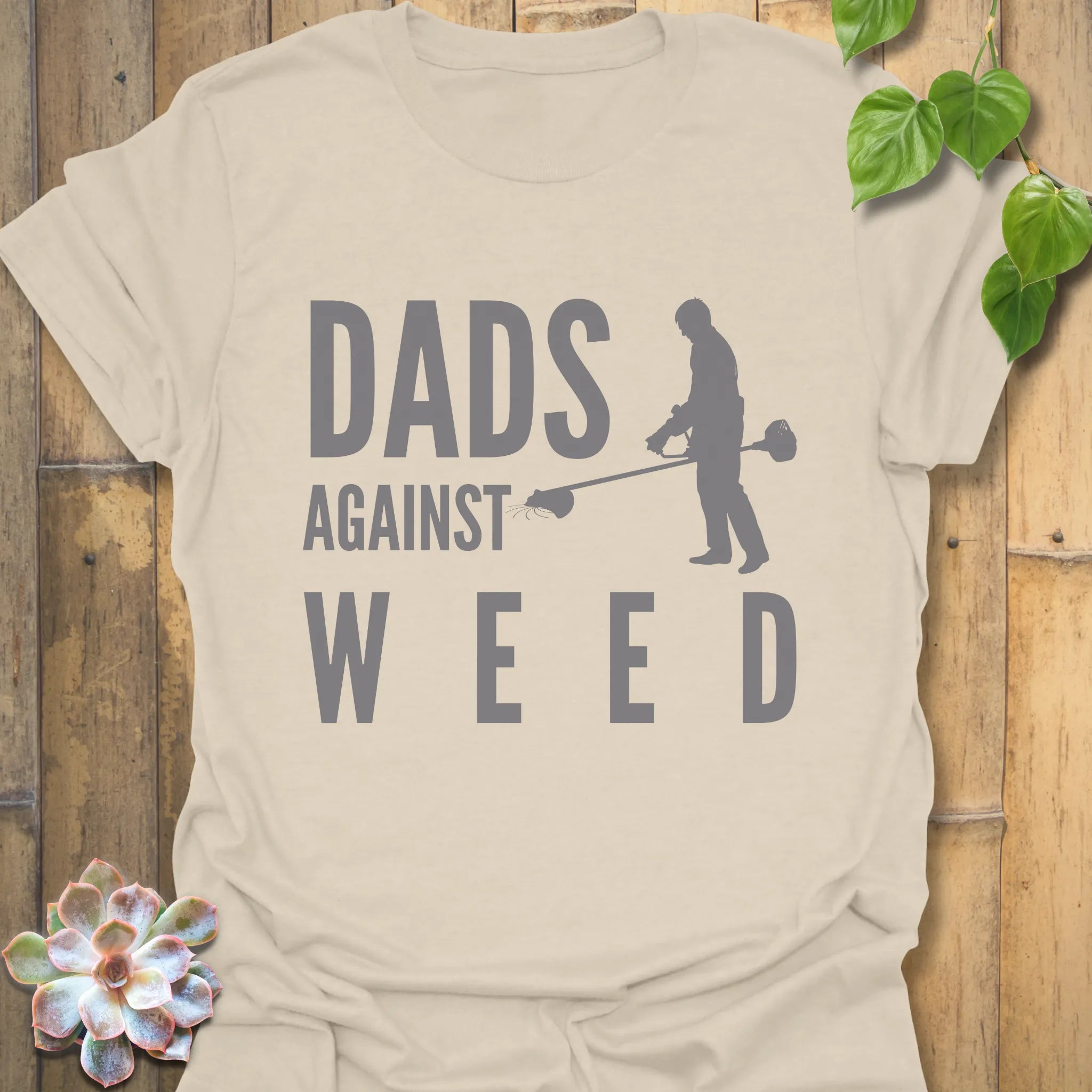 Natural t-shirt featuring the design Dad Against Weeds, weed control dad shirt.