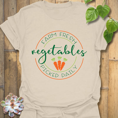 Natural t-shirt featuring the design Farm Fresh Vegetables Picked Daily with rustic vegetable print, eco-friendly farm shirt.