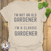 Natural t-shirt featuring the design “I’m not an older gardener, I’m a classic gardener” funny garden graphic tee.