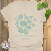 Natural t-shirt featuring the design September Morning Glory with a flower print, a soft neutral floral graphic tee for casual outfits.