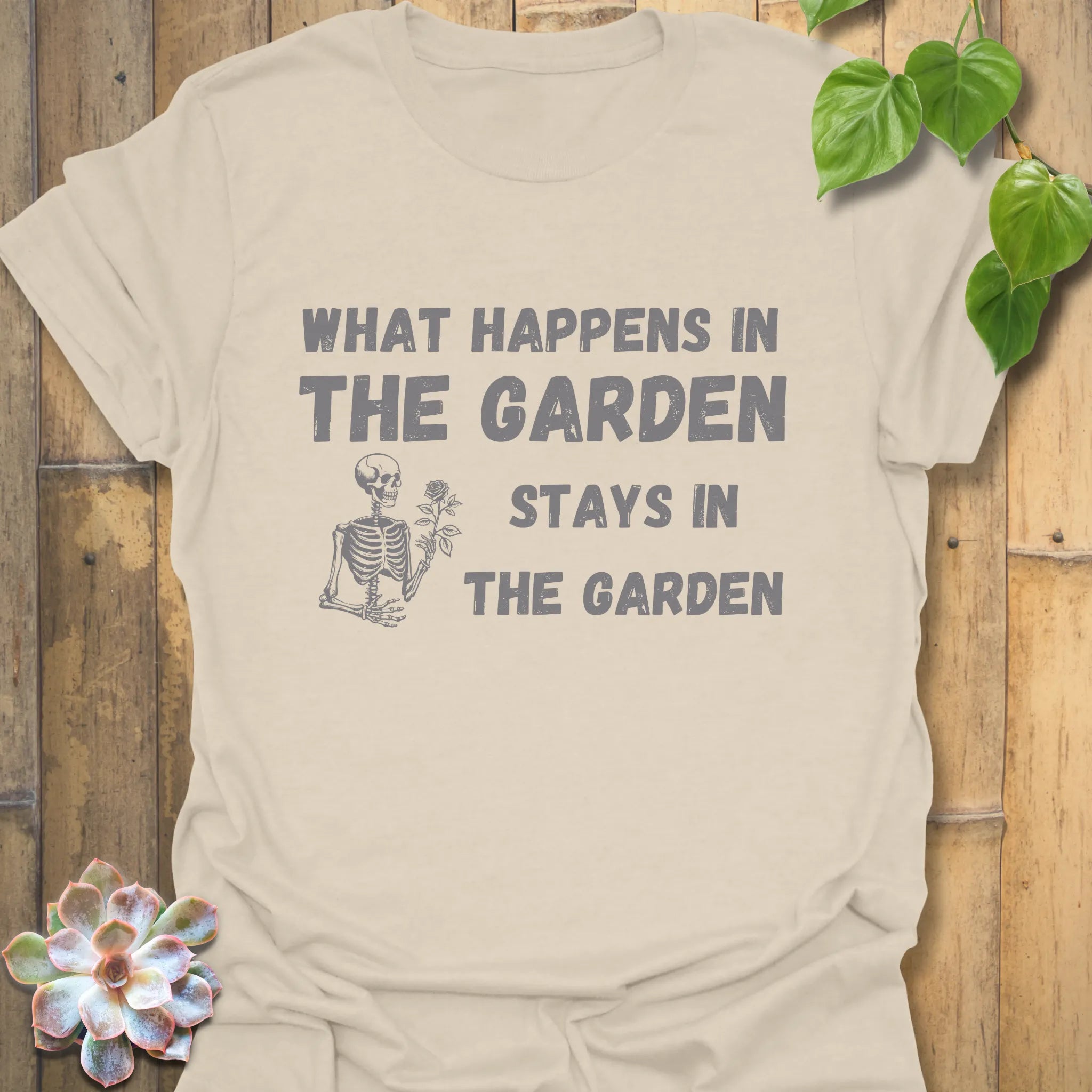 Natural t-shirt featuring the design What Happens in the Garden Stays in the Garden, eco-friendly garden shirt