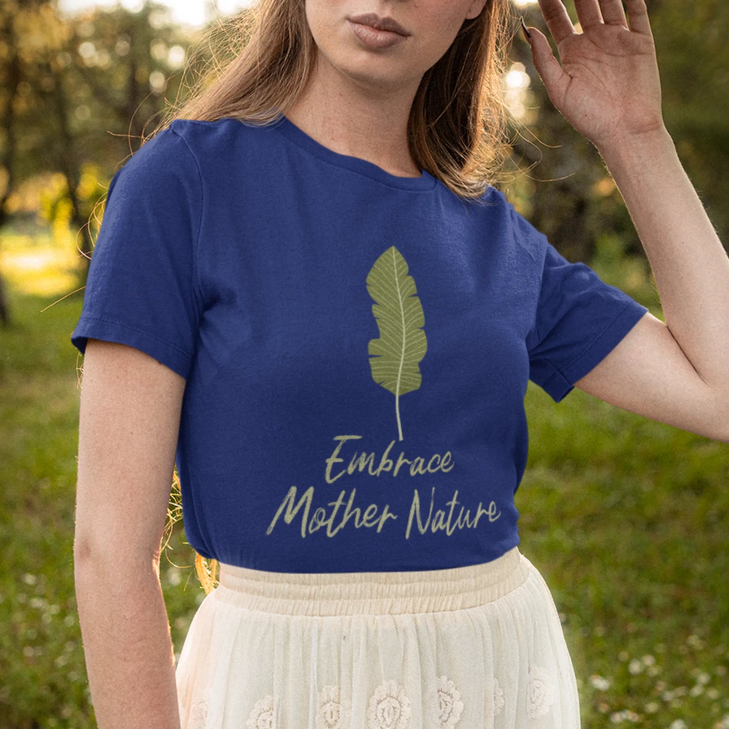 Navy blue t-shirt with the “Embrace Mother Nature” design and a small leaf print