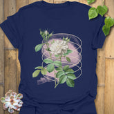 Navy t-shirt featuring the Blossom Whisper design of a blooming flower artwork