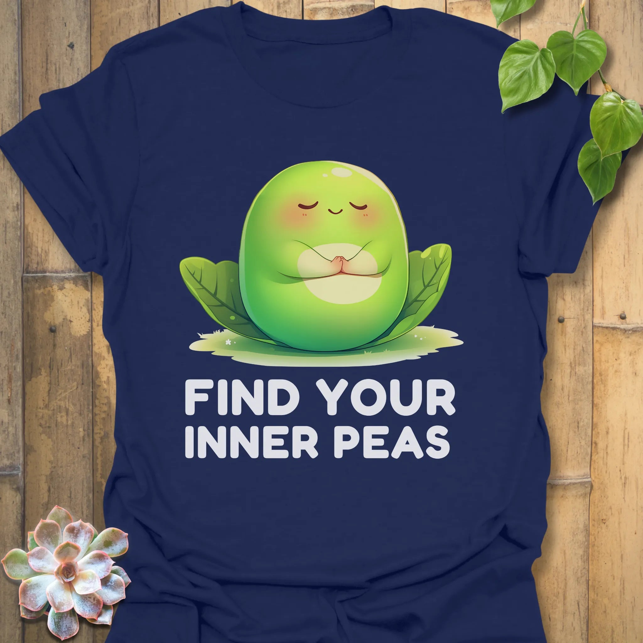 Navy t-shirt featuring the design Find Your Inner Peas printed in bold green letters with playful pea graphics