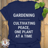 Navy t-shirt featuring the design Gardening Cultivating Peace One Plant at a Time, eco garden shirt.
