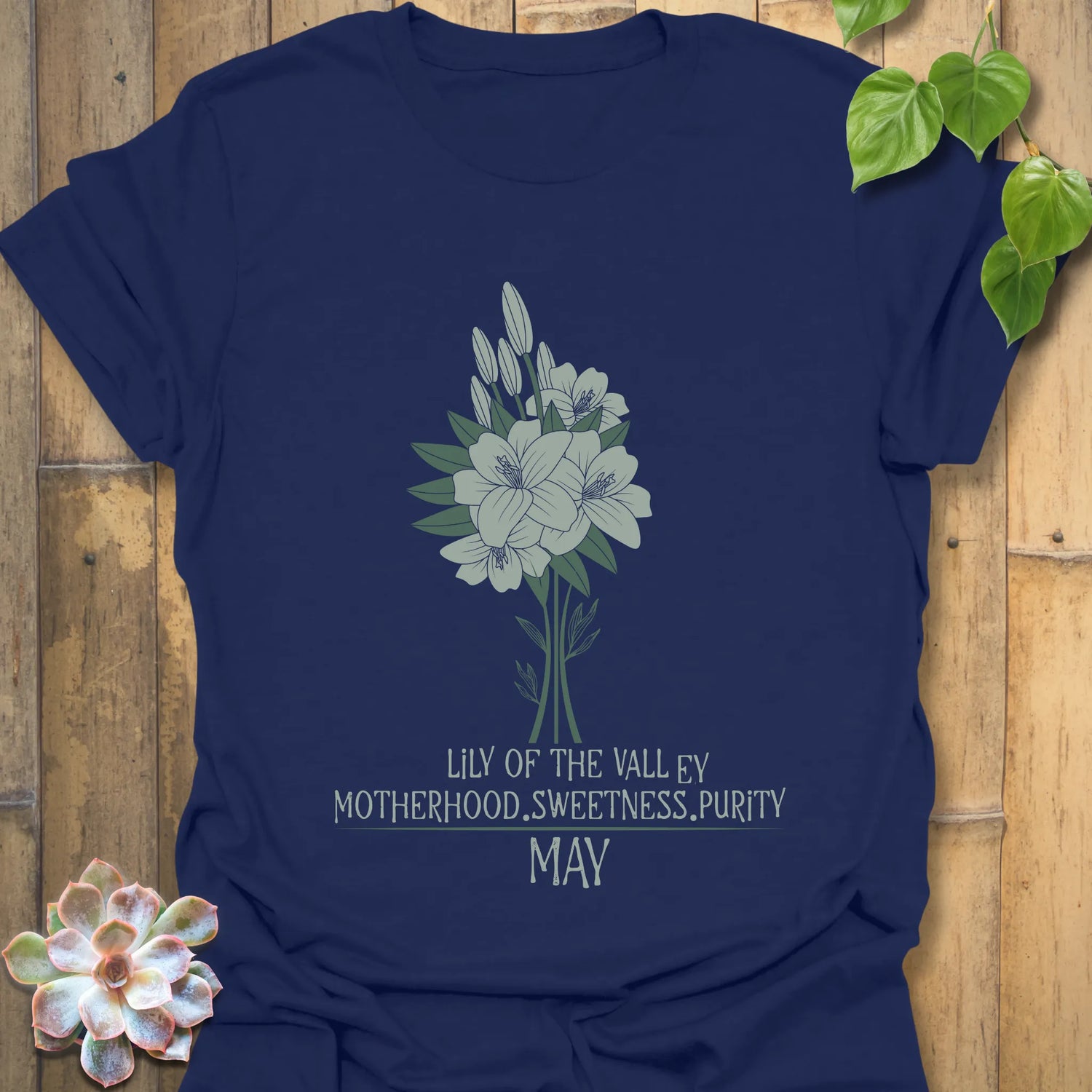 Navy t-shirt featuring the design May Lily of the Valley with Rose flower print, an elegant floral graphic tee perfect for botanical style.