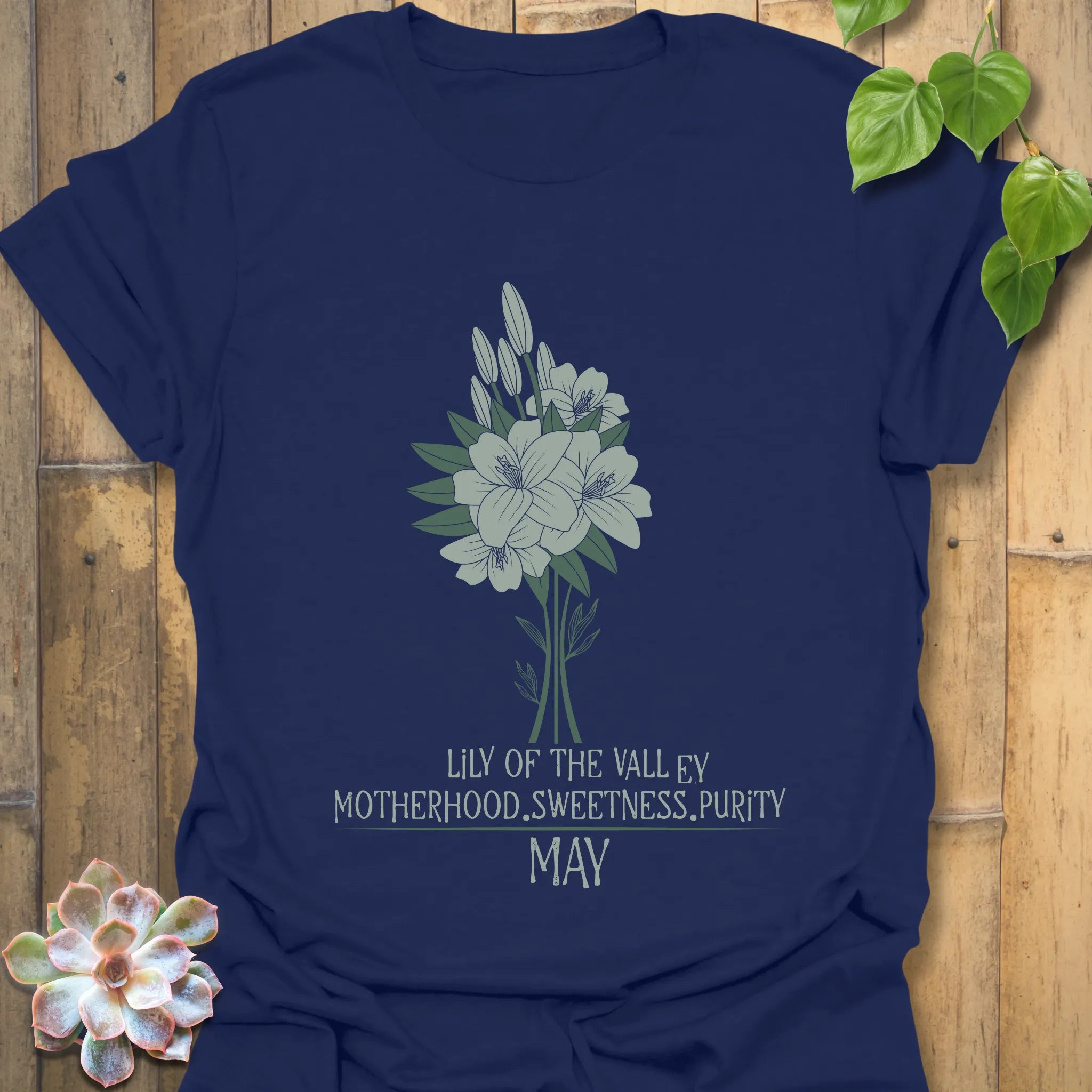 Navy t-shirt featuring the design May Lily of the Valley with Rose flower print, an elegant floral graphic tee perfect for botanical style.
